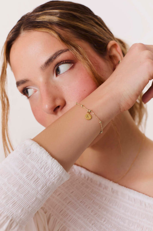 ARMBAND ADAMYA BUCHSTABE PLATTE VERGOLDET